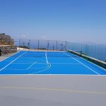 Tennis and basketball court with sea view