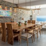 Wooden dining table indoors with view to the sea