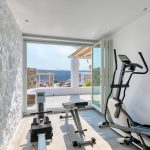 indoor gym with pool view