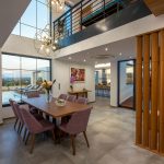 Dining area with wooden details and access to the kitchen