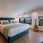 Attic bedroom with guitar