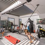 TRX session in the fitness room of villa Orizontes