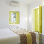 Double bedroom with yellow doors