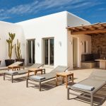 Sunbeds cactus and white Cycladic walls