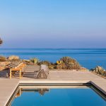 pool sun loungers and sea view