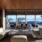 Shaded living area with access to the pool deck