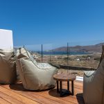 Sun loungers on the private balcony looking at Ftelia Beach