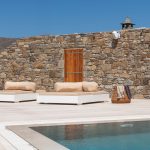 Stone walls exterior surrounding the pool