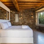 Stunning bedroom with stone walls
