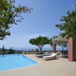 Pool, sun loungers and sea view at villa Camelia
