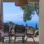 Outdoor dining area with view of the Ionian Sea in villa Camelia