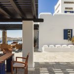 White Cycladic walls and dining area