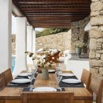 outdoor dining space with wooden shades