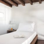 Single bed and wooden roof details