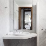 En-suite bathroom with white marble