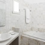 En-suite bathroom with white marble