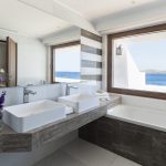Double marble sinks and sea view from the window