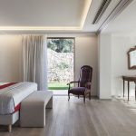 Master bedroom with king-size bed and view of the sea