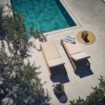 The pool with sun loungers at villa Marietta I