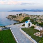 view of the chapel and the sea at villa Thalassa in Paros