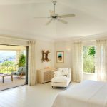 Main house bedroom with direct access to the pool terrace