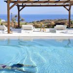 Swimming in the pool of villa Anatoli in Mykonos