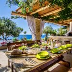 Having lunch under the shaded pergola with a captivating view