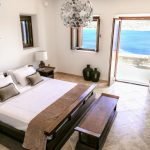 Bedroom with king-size bed and sea view