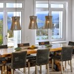 Indoor dining space with windows overlooking the pool