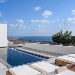 Pool view towards Akrotiri in Santorini