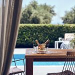 Drink a rose wine by the pool at the villa in Zakynthos