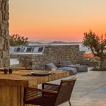 Dine while sun sets at villa Moni in Mykonos