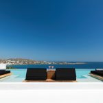Infinity pool view of Psarou beach in Mykonos