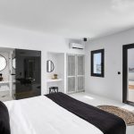 luxury en-suite bedroom with private balcony