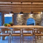 Wooden dining table under the shaded area