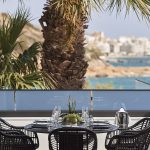 Outdoor dining with view of Almyros Beach