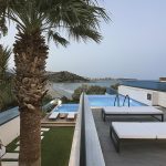 palm tress next to the pool and sea in Crete