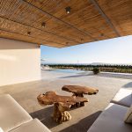 Outdoor shaded lounge area with vintage furniture