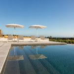 Comfy sun loungers by the pool at villa Faragas