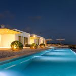 Pool at night and bushes of villa Faragas
