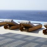 Sun loungers overlooking Kalo Livadi Beach in Mykonos