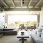 Shaded lounge area near the pool in Myconian villa