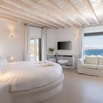 Double bedroom with round bed in Myconian Villa