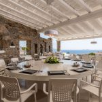 Dining under the shaded pergola at Queen Estate